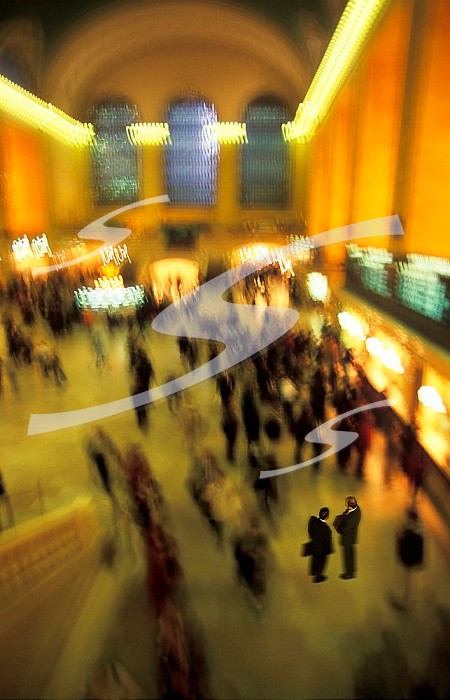 USA, New York City, commuters blurred inside Grand Central train station.