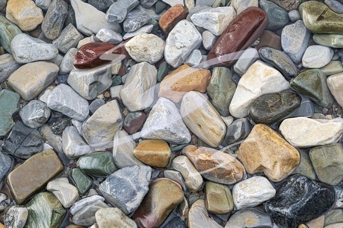 Pebbles along the shoreline of Upper Waterton Lake Waterton Lakes National Park Alberta Canada. Canada / Alberta
