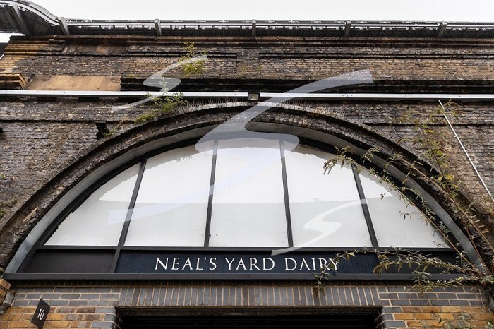 London, England, Uk, 20 October 2023 - Outside Neal’s Yard Dairy in Bermondsey, under a Victorian railway viaduct. Neal’s Yard Dairy is a London-founded artisanal cheese retailer and worldwide wholesaler.. British cheese