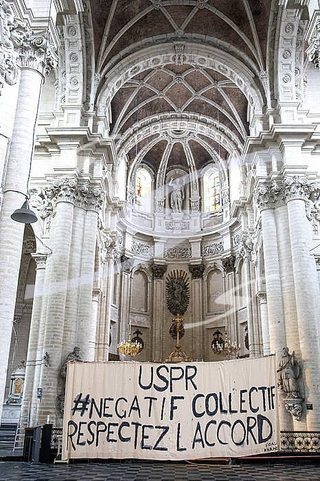 Banner in Beguinage catholic church, Brussels, Belgium. Union des sans-papier pour la Regularisation