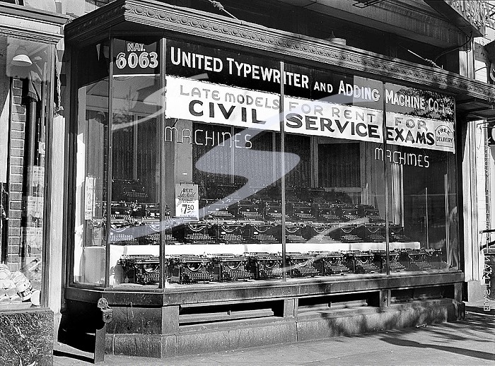 Rows of typewriters on display in store window, United Typewriter and Adding Machine Co., Washington, D.C., USA, David Myers, U.S. Farm Security Administration, July 1939