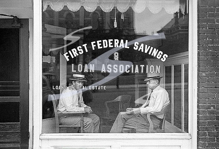 Two men sitting in window of First Federal Savings and Loan Association office, Marion, Ohio, USA, Ben Shahn, U.S. Farm Security Administration, July 1938