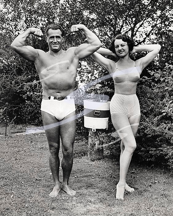 Rye, New York, 1936 Charles Atlas, noted physical culturist, who himself holds a 