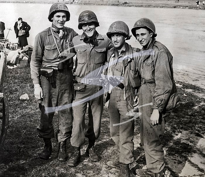 Torgau, Germany, May 4, 1945 These Yankee soldiers of the 1st battalion, 273rd infantry of the 69th division, U.S. First army, were among the first to greet the advancing Russian soldiers as the two allied armies linked up at Torgau on the Elbe river. They are, left to right; PFC Frank B. Huff Washington, VA.; CPL. James J. Mcdonnell, Peabody, Mass.; Lieut. William D. Robertson, Los Angeles, Calif., and PFC Paul Staus, Bronx, N.Y.. First Yanks To Meet Reds In Germany