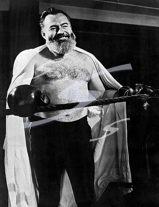 England, May 18, 1944 Author Ernest Hemingway, Collier’s war correspondent, is conditioning himself for the rigors of reporting the opening of the second front in World War II. Hemingway, now in England, won’t be able to discard his gray-streaked beard for the duration because it is the distinguishing mark in pictures on his passport and military credentials.. Hemingway War Correspondent