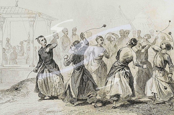 Ottoman Empire. Turkey. Men exercising in Tomak game. Martial art. Traditional game in which woll balls are used on leather straps. Engraving by Lemaitre, Lalaisse and Chaillot. Historia de Turquia by Joseph Marie Jouannin (1783-1844) and Jules Van Gaver, 1840.. Turkey. Men exercising in Tomak. Engraving, 19th century.