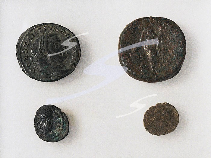 Roman coins (83-348 AD). From the Tower of Harcules, La Coruna, Galicia, Spain. Archaeological and History Museum (San Anton Castle). A Coruna, Galicia, Spain.. Roman coins.
