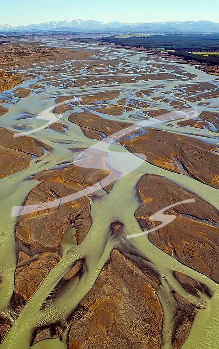 Aerial view of the braided Waimakariri River showing the shallow, wide, inter-weaving channels and abundant sediments. Canterbury Plains, New Zealand.
